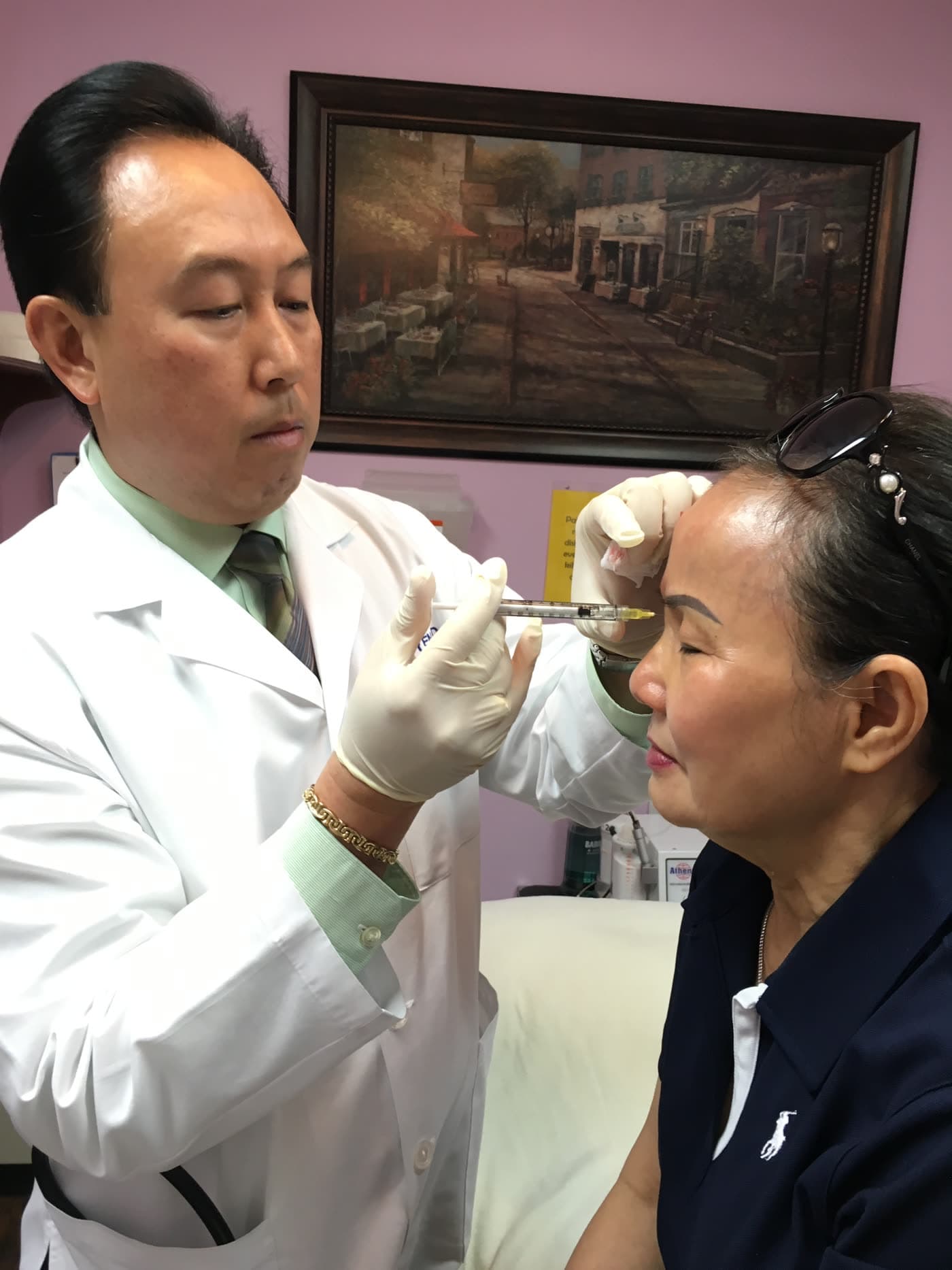 Dr. Hac Nguyen administering a Botox injection to a patient